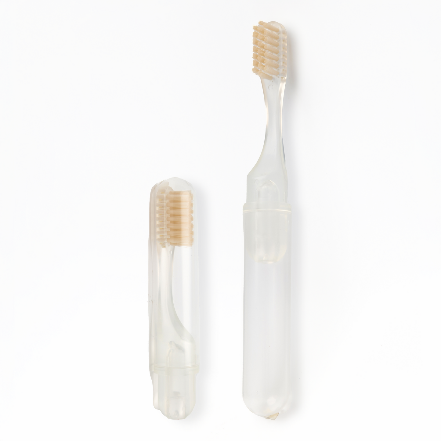 Transparent toothbrush with beige bristles on a white background