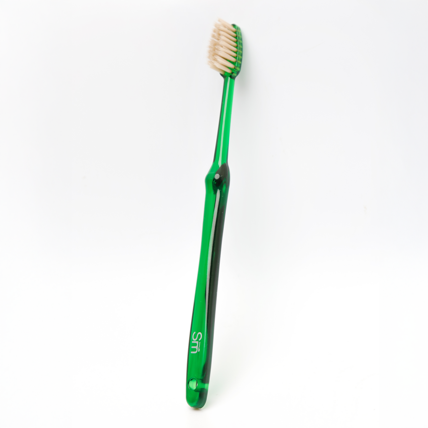 Green toothbrush on a white background